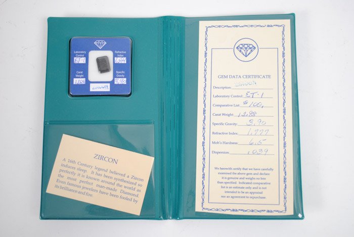Unset Zircon Gemstone, 12.88 Carat Weight: Complete with Gem Data Certificate and padded display envelope/case. Included romance card states: "A 16th Century legend believed a Zircon induces sleep. It has been synthesized so perfectly it is kn