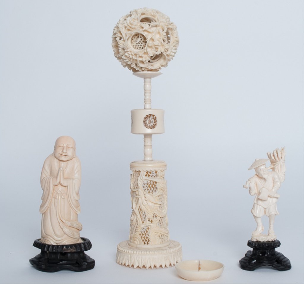Collection of Carved Asian Figures: From turn of the 20th C, to include a Buddhist priest or monk on wood stand, a wood gatherer with hat on a wood stand and a puzzle ball on multi-section carved stand. Some damage to ball.
