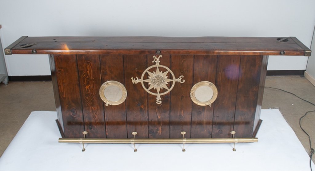 Ship's Hatch Cover Bar: With nautical and brass fittings. Height: 45", Width: 10-3/4", Depth: 18"; the top is made from reclaimed ship's hatch; most likely oak.