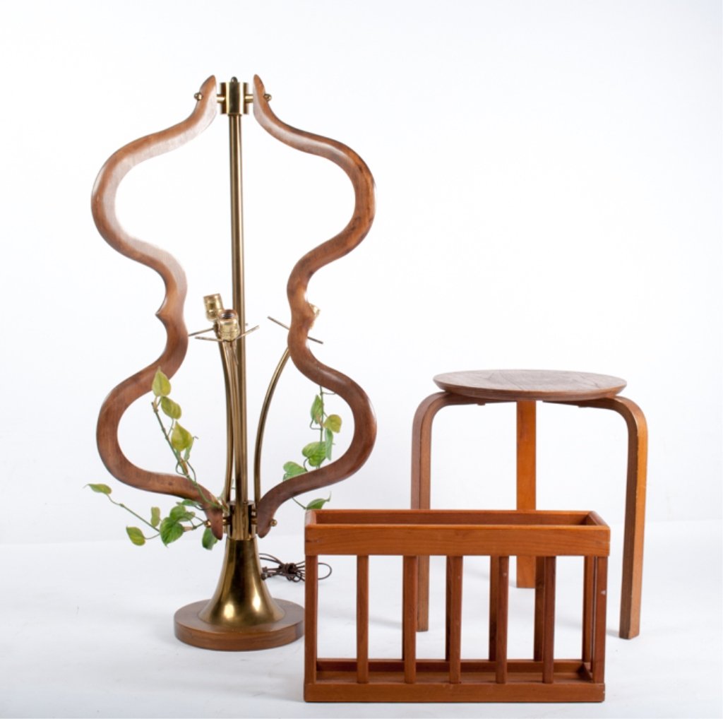 Mid-Century Lamp, Stand, and Magazine Rack: Brass and wood three pronged lamp with three light bulb sockets and faux leaf and vine embellishments; measures approximately 38-1/4" tall, and has a 10" diameter base; apparently in working condition