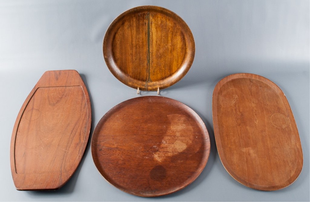 Four (4) Wooden Swedish Trays: Large round tray measures approximately 17-14" in diameter; small round tray measures approximately 14-1/2"; oblong tray measures approximately 21-1/2" long and 12-3/4" wide; and sharp edged oblong tr