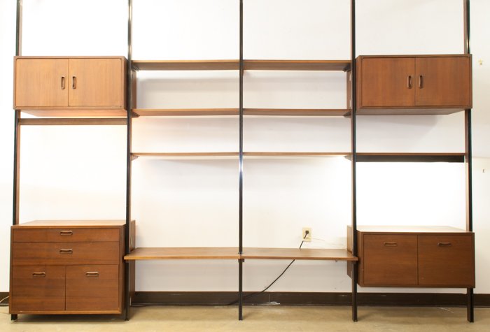 Omni Walnut Wall Unit By George Nelson: Walnut with open shelving and storage compartments; measures approximately 8' tall, and 129" wide.
