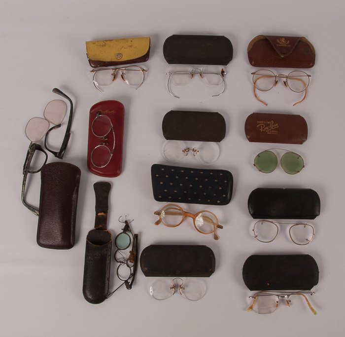 Collection of Twelve (12) Vintage Eyeglasses: Also includes twelve cases; various shapes and sizes; several are broken.