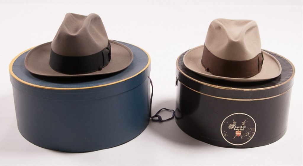 Two (2) Borsalino Fedoras: Both Borsalino felt fedoras come with hat boxes; the gray fedora's hat size is 7-1/2 and the taupe fedora's hat size is 7-3/8; the gray fedora has a black hat band and the taupe fedora has a brown hat