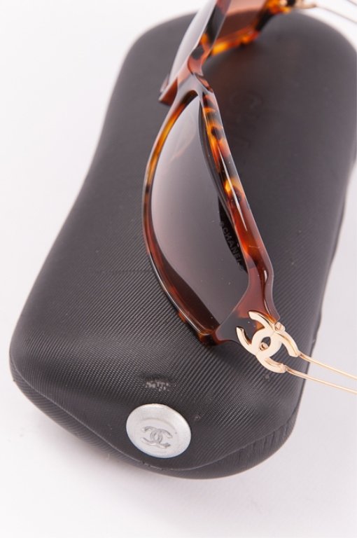 Chanel Sunglasses: Shades measures approximately 5-1/2" wide, and 1-1/2" tall, and arms measure approximately 4" long; Chanel logo at hinge of each arm; top of left lens is popped out a bit; includes hard shell Chanel c
