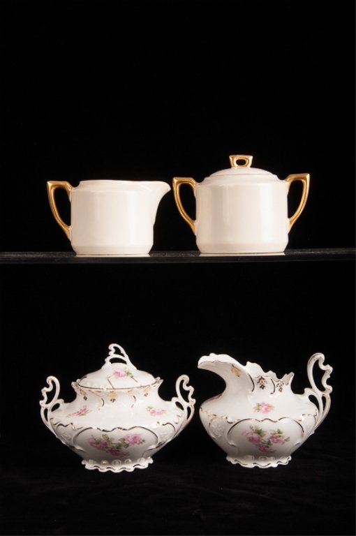 Two (2) Sugar Jar and Creamer Sets: Includes a Moritz Zdekauer lidded sugar jar and creamer with gilded and floral embellishments that measures approximately 5" and 4" tall respectively as well as a C.T. Altwasser creamer and lidded sug