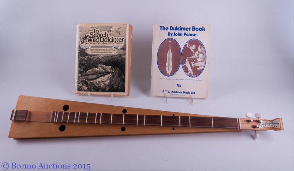 John Pearse Dulcimer & Two (2) Books: John Pearse Dulcimer & Two (2) Books John Pearse dulcimer with tapered construction and round sound holes; features white plastic tuners, a poplar soundboard, and John Pearse tag to head; measures app