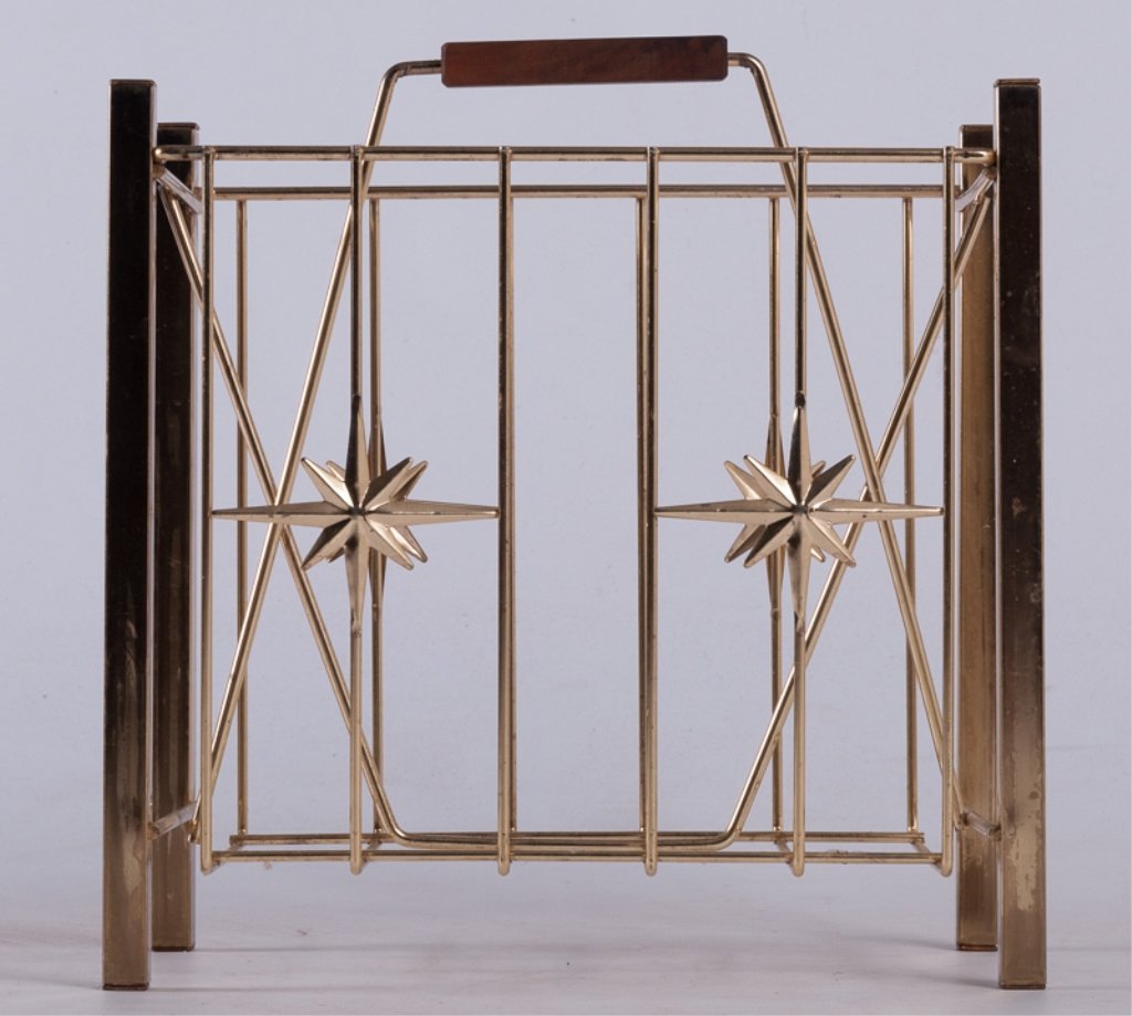 Mid-Century Atomic Starburst Brass Magazine Rack: Mid-century atomic starburst brass magazine rack with wooden handle; measures approximately 16-1/2" tall to top of handle, 15-1/2" wide, and 9" deep.