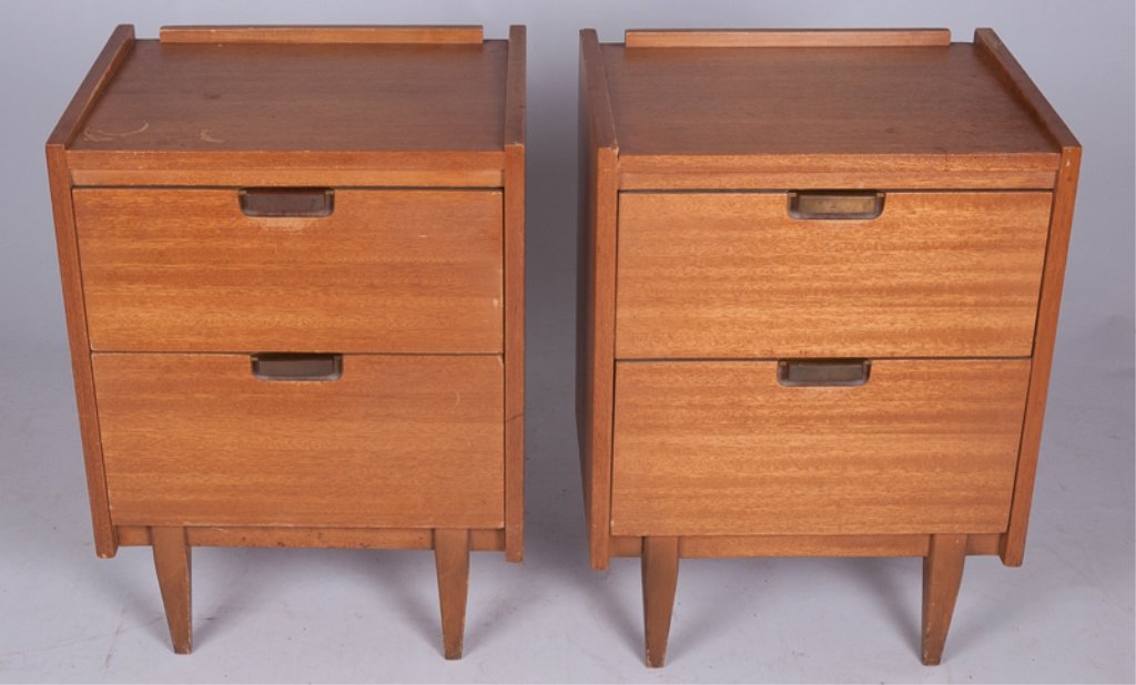 Hooker "Mainline" Pair of Nightstands: Pair of Hooker "Mainline" oak nightstands each featuring two drawers with brass pulls, tapered legs, and marked to inside of top drawer "E Mainline Hooker" with the "Hooker" fading; measures approxima