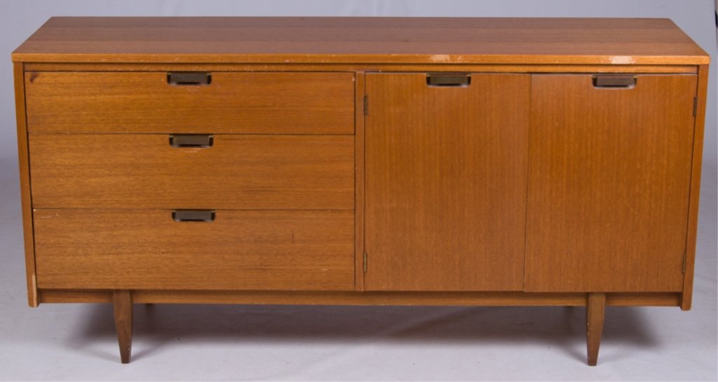 Hooker "Mainline" Oak Sideboard: Mid-century "Mainline" oak sideboard by Hooker Furniture; features three drawers with brass pulls on one side and two cabinet doors opening to reveal six drawers on the opposite side; top inside drawe