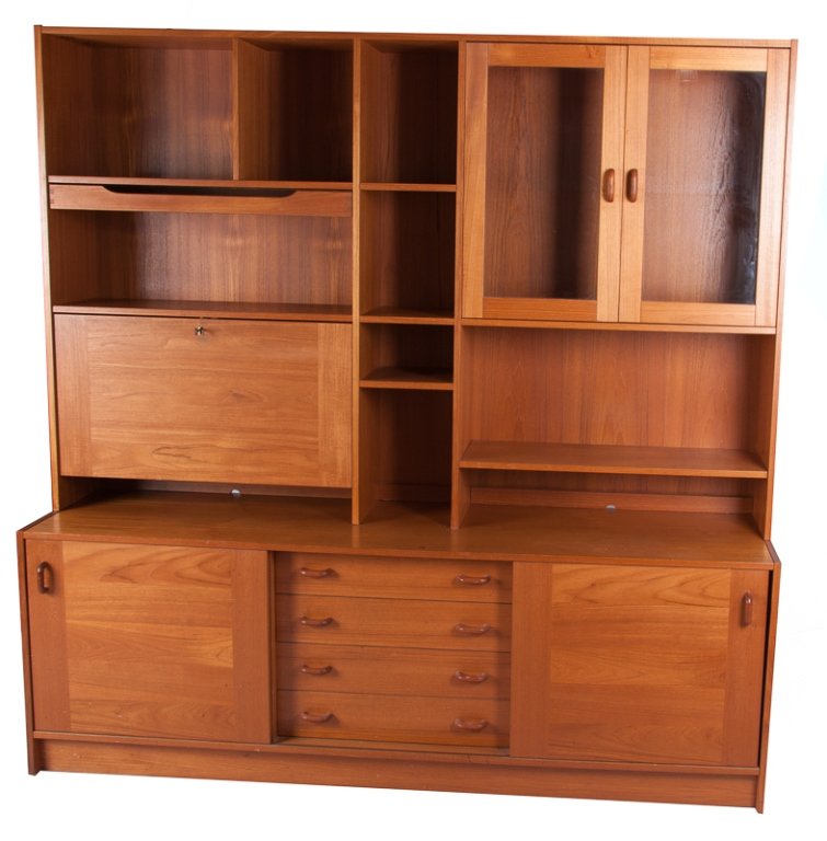 Domino Mobler Mid-Century Teakwood Wall Unit: Domino Mobler, mid-century, teakwood wall unit; top features a two-door, glass-front cabinet housing a light and a label to inside of left cabinet door that reads "Domino Mobler Furniture Made in Denm