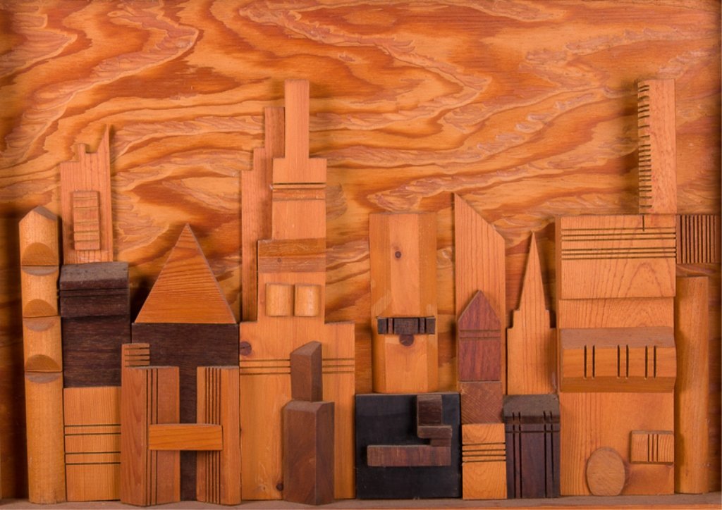 3-D Cityscape Wood Art: Three-dimensional city skyline of contrasting wood varieties; unsigned; measures approximately 18-1/2" tall, 23-1/2" wide, and 3" deep; in Good condition.