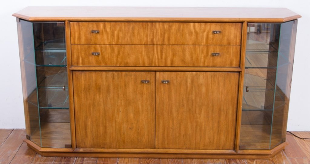 Drexel Mid-Century/ Modern Sideboard: Drexel mid-century/ modern sideboard with angled glass cabinet doors to each side housing two glass shelves apiece, two drawers (flatware felt to top drawers), and a two-door bottom cabinet with drawe