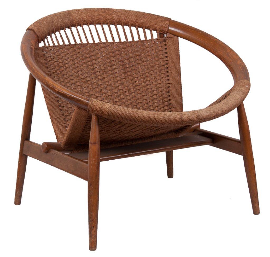 Illum Wikkelso "Ringstol" Chair: Mid-century Illum Wikkelso "Ringstol" chair features a hoop style beech wood frame with rattan woven seat; marked underneath "Made in Spain"; measures approximately 28-1/2" tall to top of back, 16-1/2