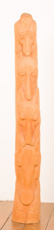 Carved Animal Figures Totem Pole: Carved totem pole wood sculpture depicting animal figures; measures approximately 53" tall, 7-1/2" wide and 6-3/4" deep; in Very Good condition.