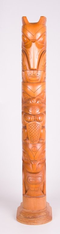 Authentic Canadian Indian Totem Pole Carving: Authentic Canadian Indian totem pole carving; signed to back "Carved by B. Jackson Age. 25 Killar, Clan."; sticker to back reads "Certified by the Department of Indian Affairs and Northern Development