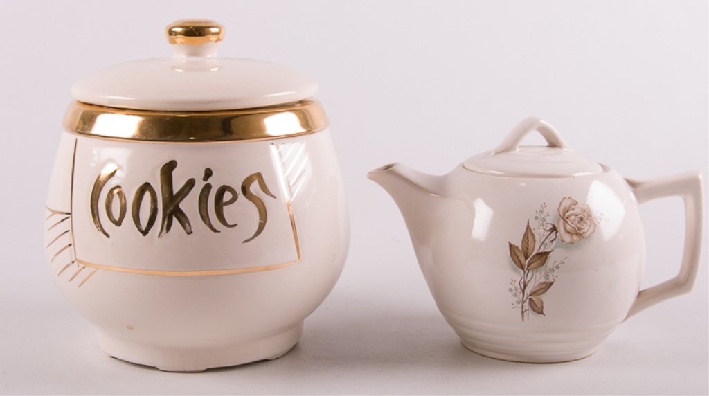 McCoy Tea Pot & Gilded Cookie Jar, Two (2): Includes a white teapot with floral motif and a white cookie jar with gilded accents; teapot marked to bottom; teapot measures approximately 5-3/4" tall, 5-1/2" wide, and 8" deep handle to spout; cook