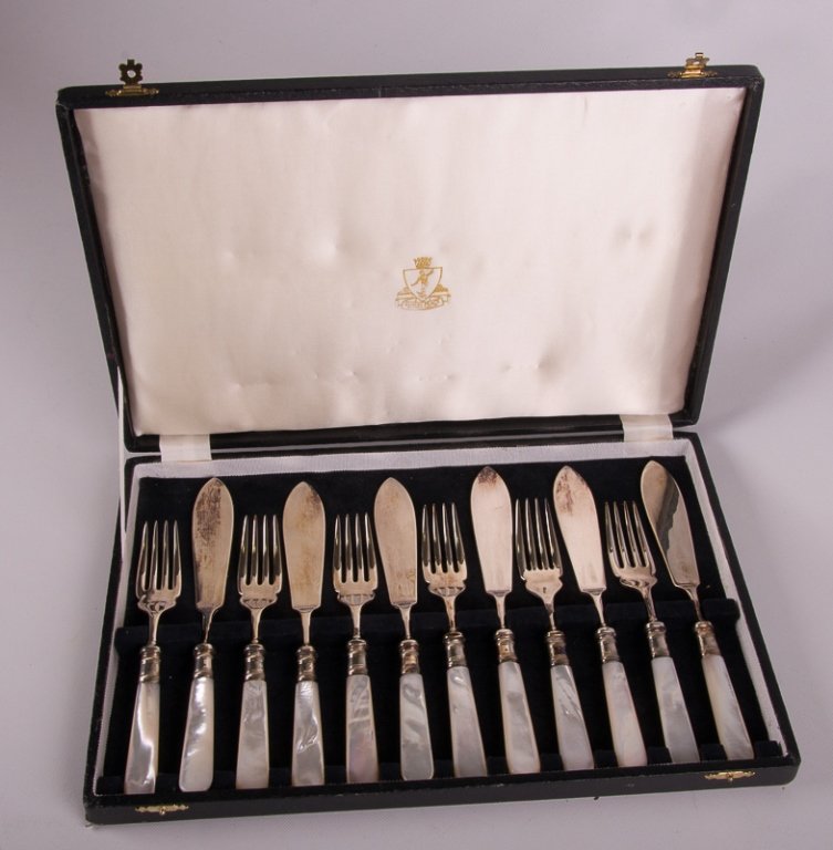 Sheffield Mother-of-Pearl Fish Set, Twelve (12): Samuel Peace Sheffield fish set with mother-of-pearl handles; includes six forks (7" long) and six knives (8-3/4" long); all marked to back "Peace Sheffield England"; includes fitted box; in overall G