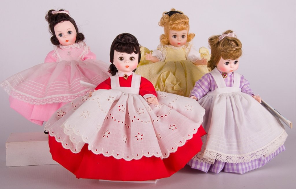 8" Madame Alexander "Little Women" Dolls: Set of four “Little Women” Madame Alexander Dolls include Meg 414, Beth 412, Jo 413, Amy 411. Set includes dolls with their original boxes. Meg and Jo have original tags. Beth has original Stand.