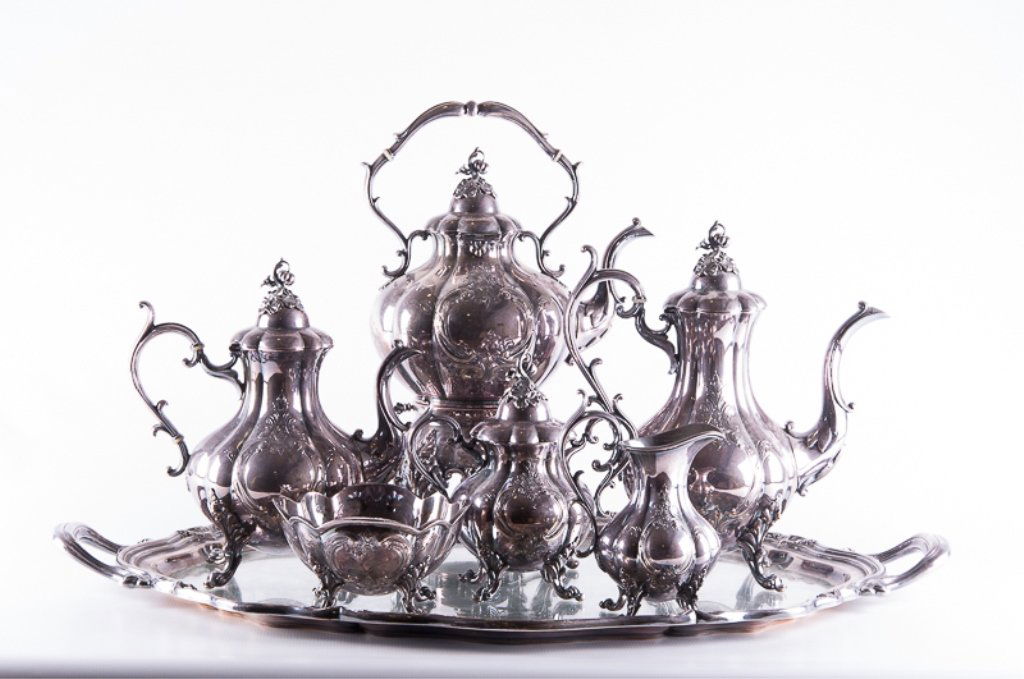 Silver Plate Reed & Barton Winthrop Tea Service: Exuberantly designed seven piece silver plate Reed & Barton "Winthrop" pattern tea/ coffee set; includes a creamer (measures approximately 7-1/4" tall to top of handle, 5-1/2" wide from handle to spou