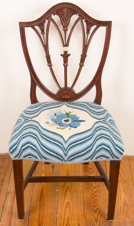 Hepplewhite Style Shield Back Side Chair: Mahogany frame with shield back and a blue and cream floral wool upholstery with tints of yellow; measures approximately 38" tall to top of back, 19" tall to top of seat, 20" wide, and 15-1/4" deep; i