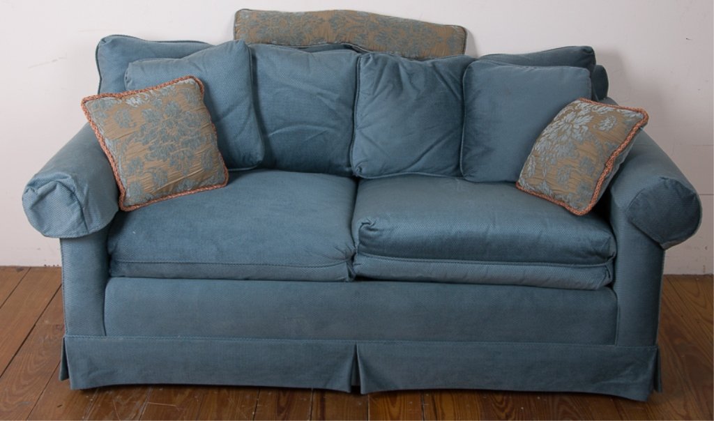 Frederick Edward Blue Love Seat: Frederick Edward blue love seat with two seat cushions, two back cushions, four pillows matching the couch, and three matching foliate design pillows (two square and one long); labeled underneath cush