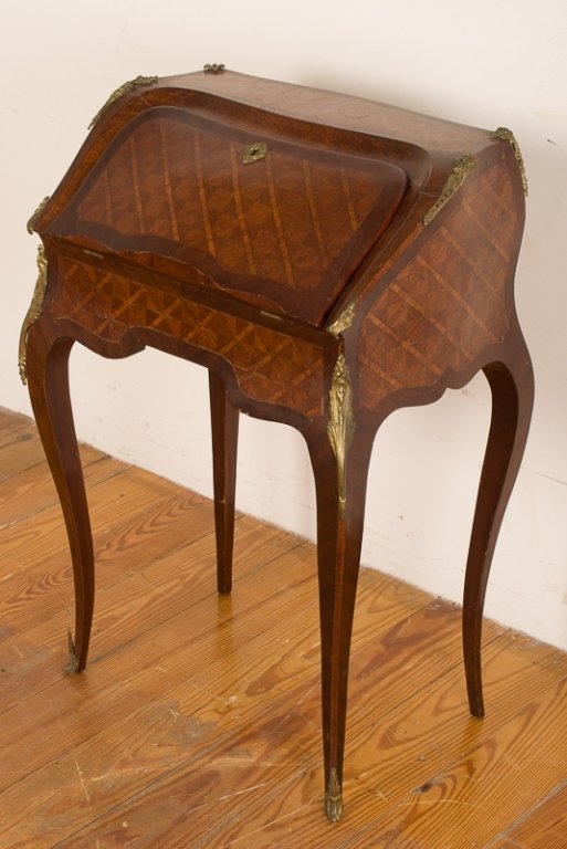 Louis XV Style Parquetry Top Lady's Desk: Antique parquetry-top lady's desk with a teal leather top to fold out surface and gilded geometric accents to edging; features three drawers with brass knobs and veneered faces as well as a sliding hi