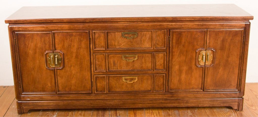 Thomasville Mystique Collection Dresser: Walnut with geometrical inlay to top; with cabinet to left and right each housing one adjustable shelf, and three drawers to middle; brass handles; "Thomasville Mystique" label to inside left of top d