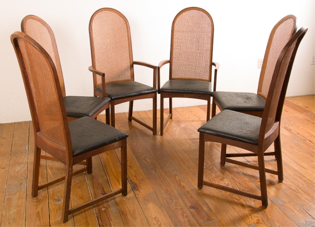 Milo Baughman Cane Back Dining Chairs, Six (6): Includes four side chairs and two carvers, all with cane backs and black vinyl seats with mahogany frames; all unmarked; side chairs measure approximately 44" tall to top of back, 18-1/4" tall to top 