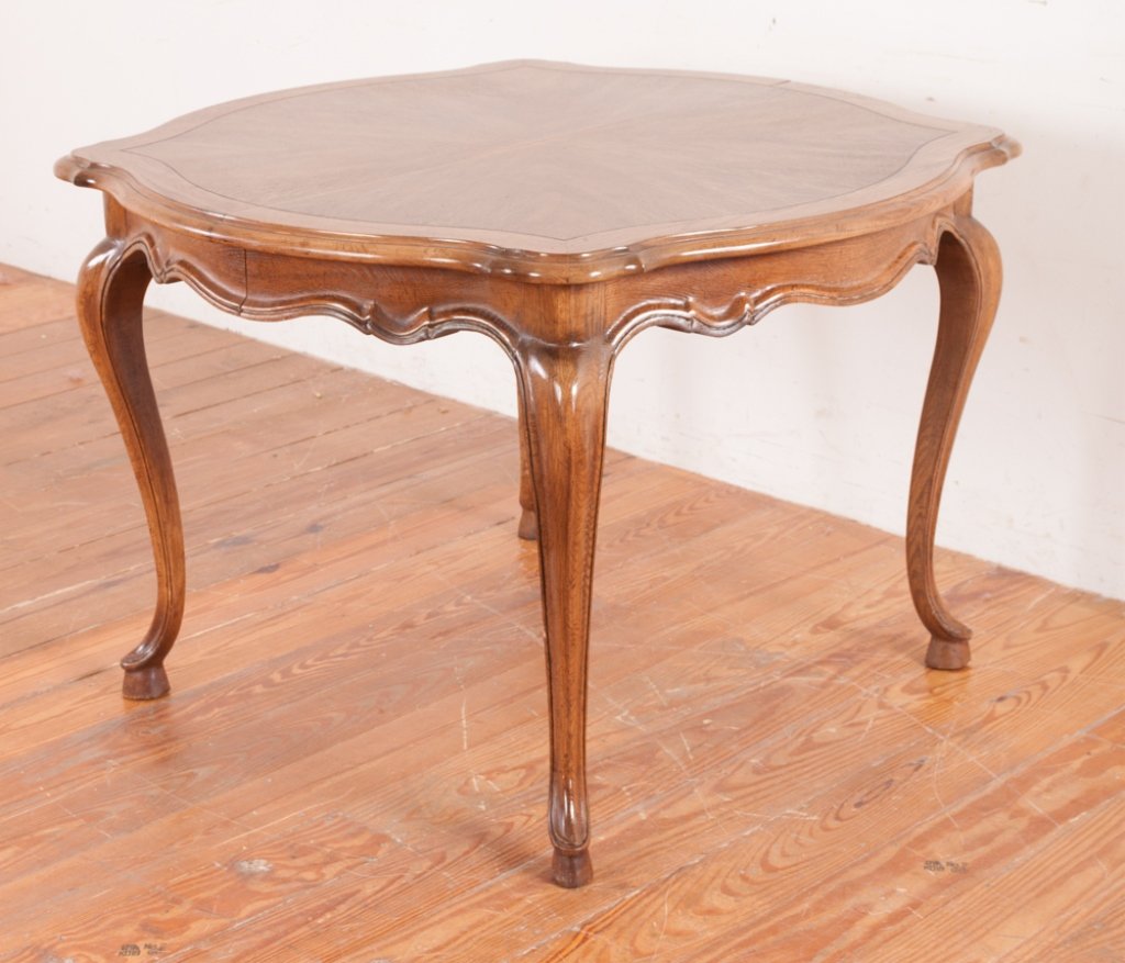 John Stuart French Style Dining Table: John Stuart French style dining table with quarter sawn top and having three leaves, includes top pads; marked to underside of top; measures approximately 30-1/4" tall, 45" wide, 45" long (without lea