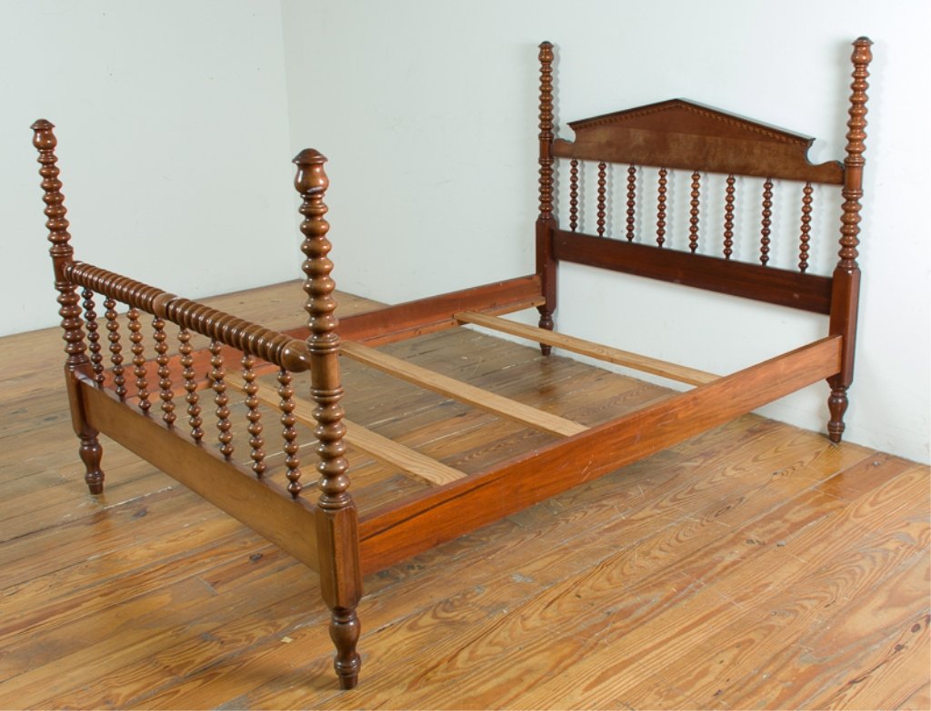 Burris Mfg. Company Spindle Bed: Solid cherry Jenny Lind style spool bed by Burris Mfg. Company, Inc. of Lincolnton, N.C.; marked to back of headboard; measures approximately 52-1/2" high, 54" wide (inside rail to inside rail), 57-1/