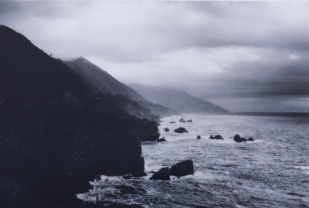 H. Eugene Smith Jr. California Coast Photo: Marked verso "California Highway 1 H. Eugene Smith Jr."; measures approximately 12-1/8" x 16-1/8" with frame and has a sight image of approximately 6-1/2" x 9-7/8"; in good overall condition.