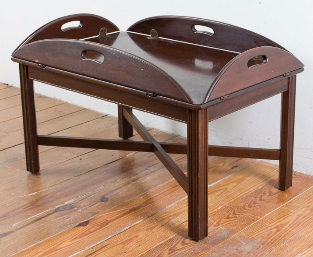 Ethan Allen Mahogany Butler Table: Ethan Allen mahogany Chippendale butler table with four brass hinged folding leaves; with a dark finish, scrolled corners, and profiled legs; marked Ethan Allen to bottom of table top; measures approx