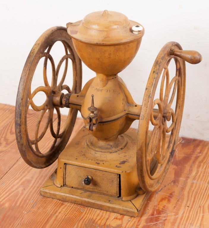 Enterprise Mfg. Co. Dual Wheel Coffee Grinder: Dual wheel coffee grinder with original paint; embossed to bottom "Enterprise Manufacturing Co. Philadelphia, Pa. Patented Oct 21 1873"; measures approximately 19-1/2" tall, 11-1/8" wide at base, and 