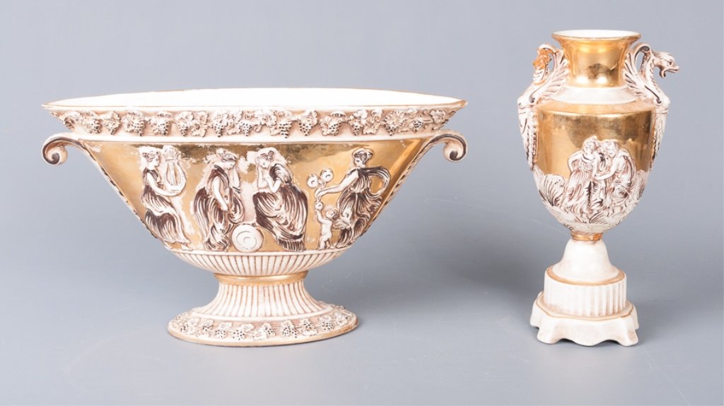Capodimonte Center Piece & Urn: Matching Capodimonte centerpiece and urn with gilded figural scenes; both marked to bottom; centerpiece measures approximately 8" tall, 14" wide, and 4-1/4" deep; in good overall condition; urn measur