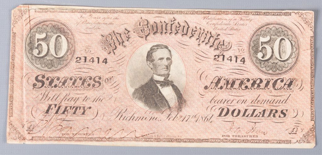 1864 Confederate $50 Bill, Richmond, VA: This $50 Confederate note has a picture of Jefferson Davis in the center. This note was printed with black ink and a pick overprint on the front and with blue ink on the back. No. 21414. Marked "Two y