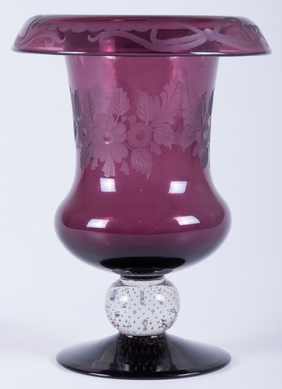Pairpoint Rolled Rim Glass Vase: Pairpoint engraved rolled rim vase with control bubble knob; purple with etched floral engravings to body and bows to rim; apparently unsigned; measures approximately 8-1/4" tall and 6-1/4" in diamete