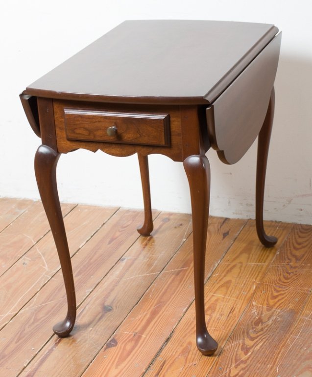 Hitchcock Queen Anne Style Butterfly Table: Hitchcock Queen Anne style single drawer drop leaf table; marked with Hitchcock placard inside drawer; measures approximately 25-1/4" high, 34" wide (with leaves extended), and 27" in depth; in good c