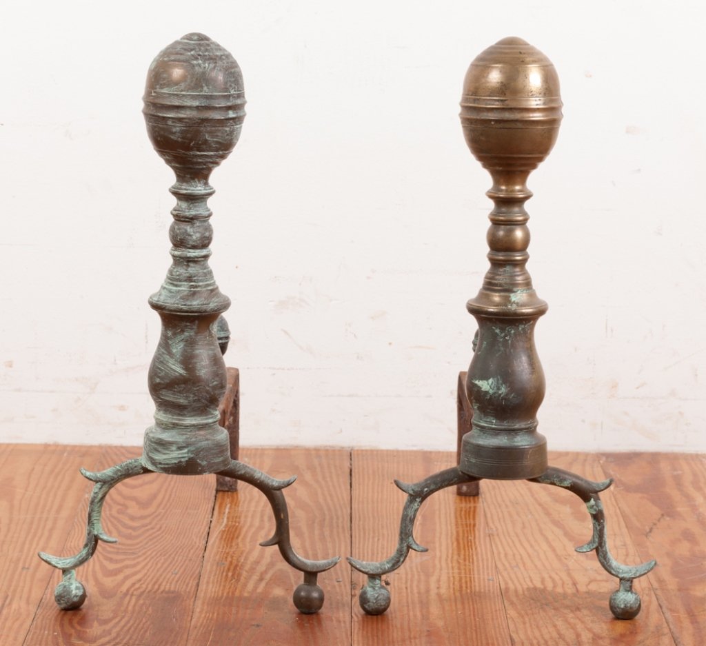 Set of 18th Century Andirons: Two symmetrical brass halves are brazed together to form these andirons with "spurred" legs and ball feet. Iron support is hand forged and peened over at the bottom, securing the mid-section to the le