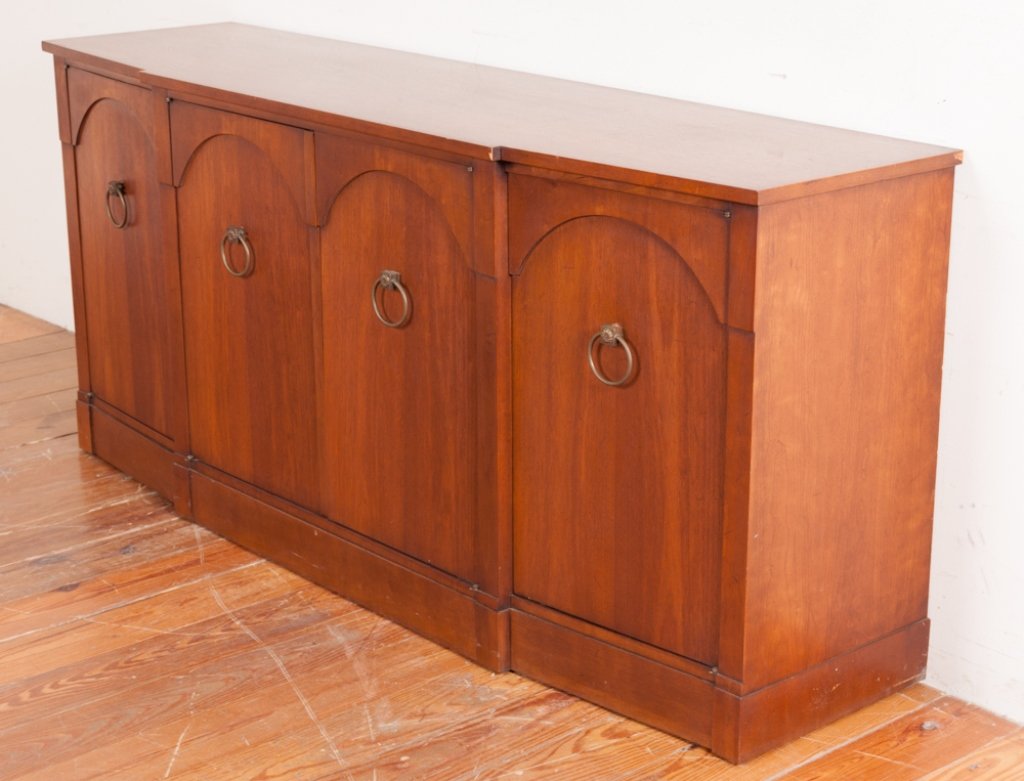 Century Furniture Sideboard: Century Furniture of Distinction four door sideboard accented with hoop drawer pulls featuring two center doors opening to four pull out drawers and each end door opening to a fixed shelf; marked to t