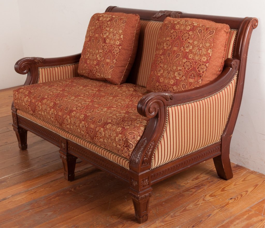 Najarian Furniture Empire Style Loveseat: Najarian Furniture Co., Inc., "bench" cushioned loveseat with complementary colored upholstery features an old-world style wood frame with carved arms, skirt, and tapered legs and accented with brass 