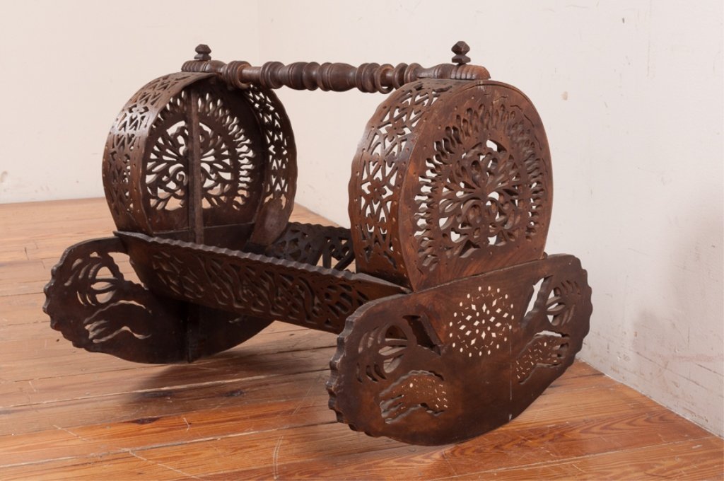Ottoman Cradle & Osmanli Besik: Wood ottoman cradle & Osmanli Besik with decorative open fretwork; measures approximately 23" high, 24" wide, and 26" long; in good condition.