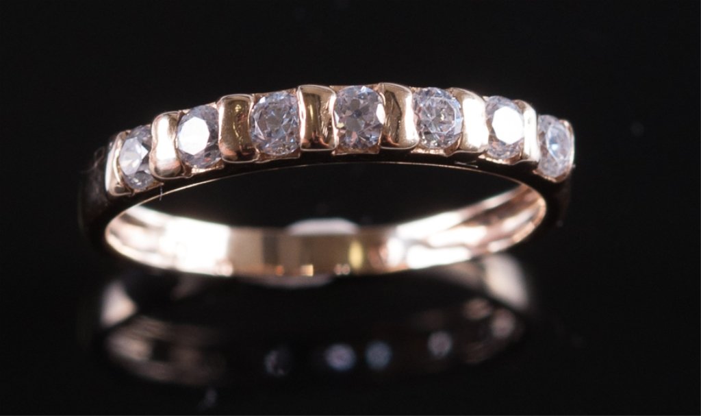 Diamond & 14K YG Bar Set Anniversary Band: Having seven (7) round brilliant cut diamonds of approximately 2.5mm each, which appear to be SI in clarity & G - H in color, bar-set in 14K yellow gold, & stamped thusly to inside lower shank. Total 