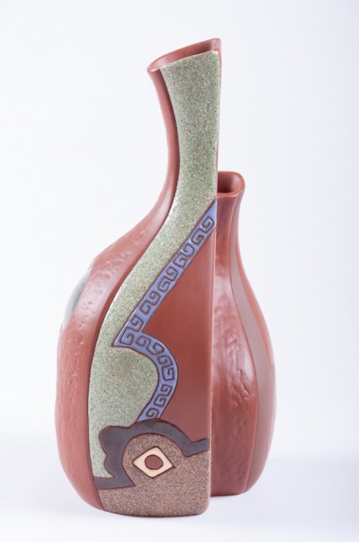 Double Stem Pottery Vase, Abstract Design: Conjoined double stem pottery vase of abstract design; stamp marked to bottom; measures approximately 9-7/8" tall and 4-1/4" wide; in good overall condition.