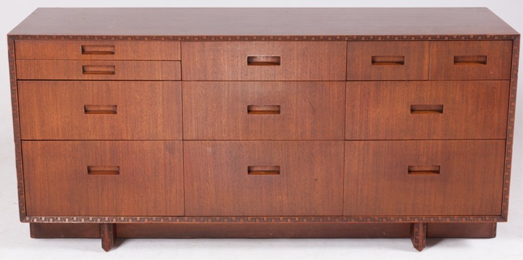 Frank Lloyd Wright Credenza by Heritage-Henredon: Created by Frank Lloyd Wright and manufactured by Heritage Henredon; eleven drawers, one with dividing insert; with carved geometric banding and Taliesin design (Taliesin name comes from Taliesin Fell