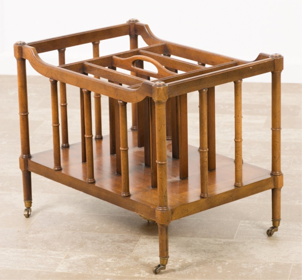 Drexel W. Nutting Canterbury Magazine Rack: Drexel fruitwood canterbury magazine rack with central carry handle, faux bamboo turned spindles on casters; measures approximately 18-1/2" high, 23" wide and 15-7/8" in depth. Stamped "144-350-3 Wall