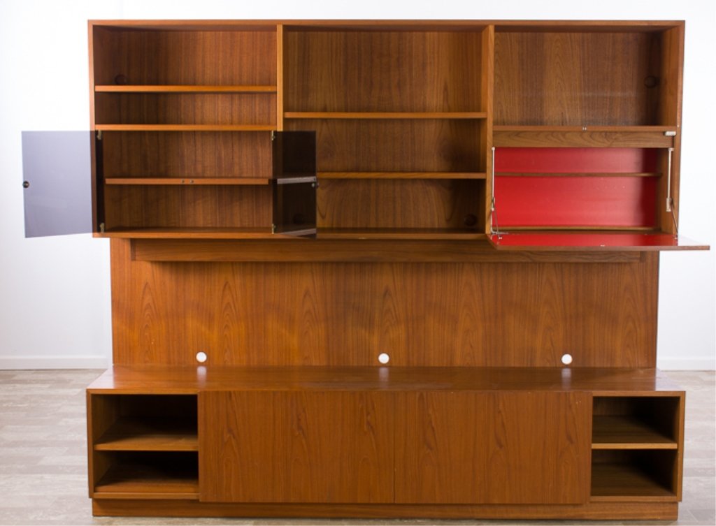AKHO Mobler Danish Bar & Entertainment Center: AKHO Mobler Danish Mid-Century modern design entertainment center with multiple shelves, double translucent black doors, pull down shelf opening to a secretary / bar area with interior light, a creden