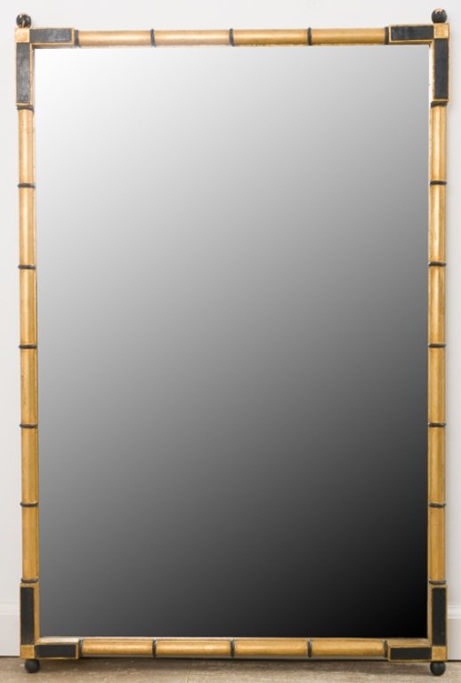 Friedman Brothers Chinoiserie Wall Mirror: Friedman Brothers Decorative Arts Inc., beveled wall mirror having a faux bamboo decorated frame with antiqued gold leaf and distressed black accent finish; measures approximately 37-1/2" high and 25-