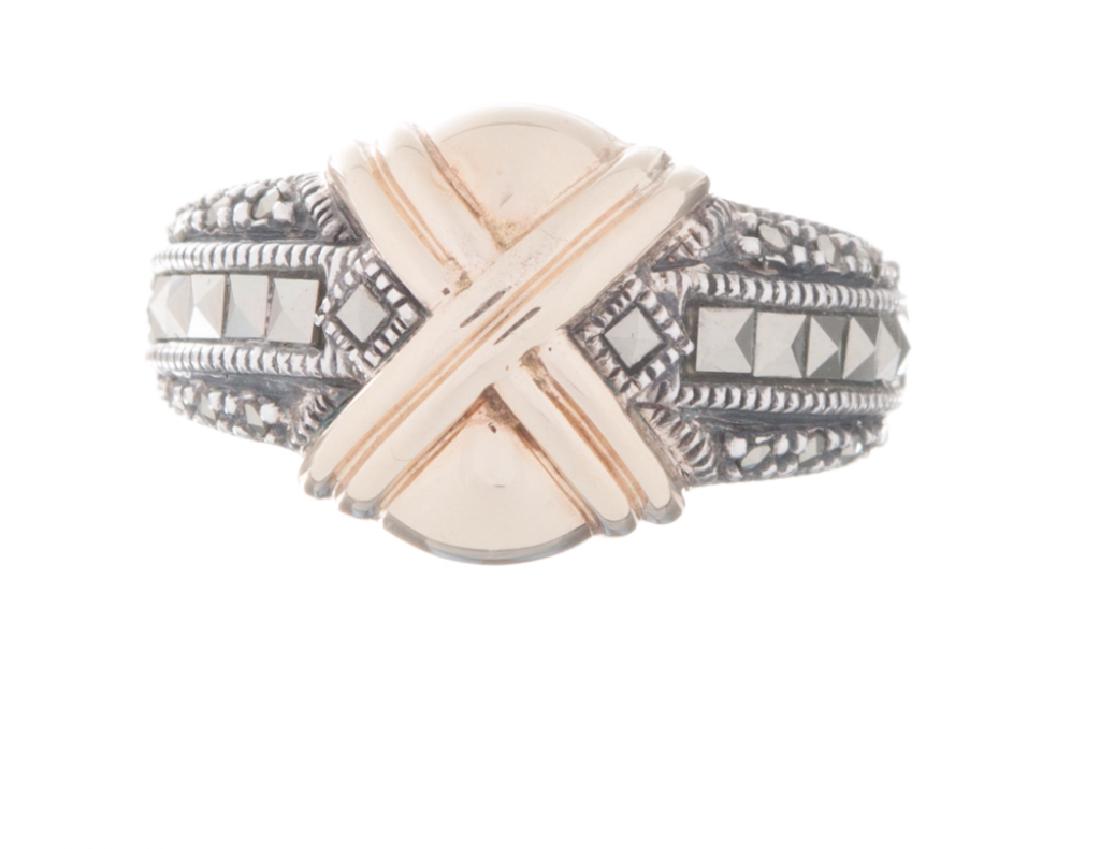 Judith Jack Sterling & 14K Gold Marcasite Ring: Square and round marcasite set on either side of a 14 karat gold X. Ring is Stamped JJ Sterling 14K Made in Thailand. Approximate finger size is 9. Weighs approximately .15 ozt.As the premier marcasit