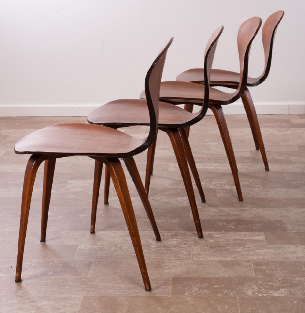 Bernardo Plycraft "Pretzel" Side Chairs Group: Four walnut pretzel side chairs designed by "Bernardo" and manufactured by Plycraft, Inc., Lawrence Mass; measures approximately 31" high, 17" wide with a seat depth of 17" and seat height of 17-1/2",